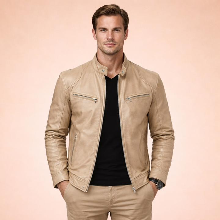 Man wearing a slim-fit tan faux leather moto jacket with a band collar, zip front, and chest pockets.