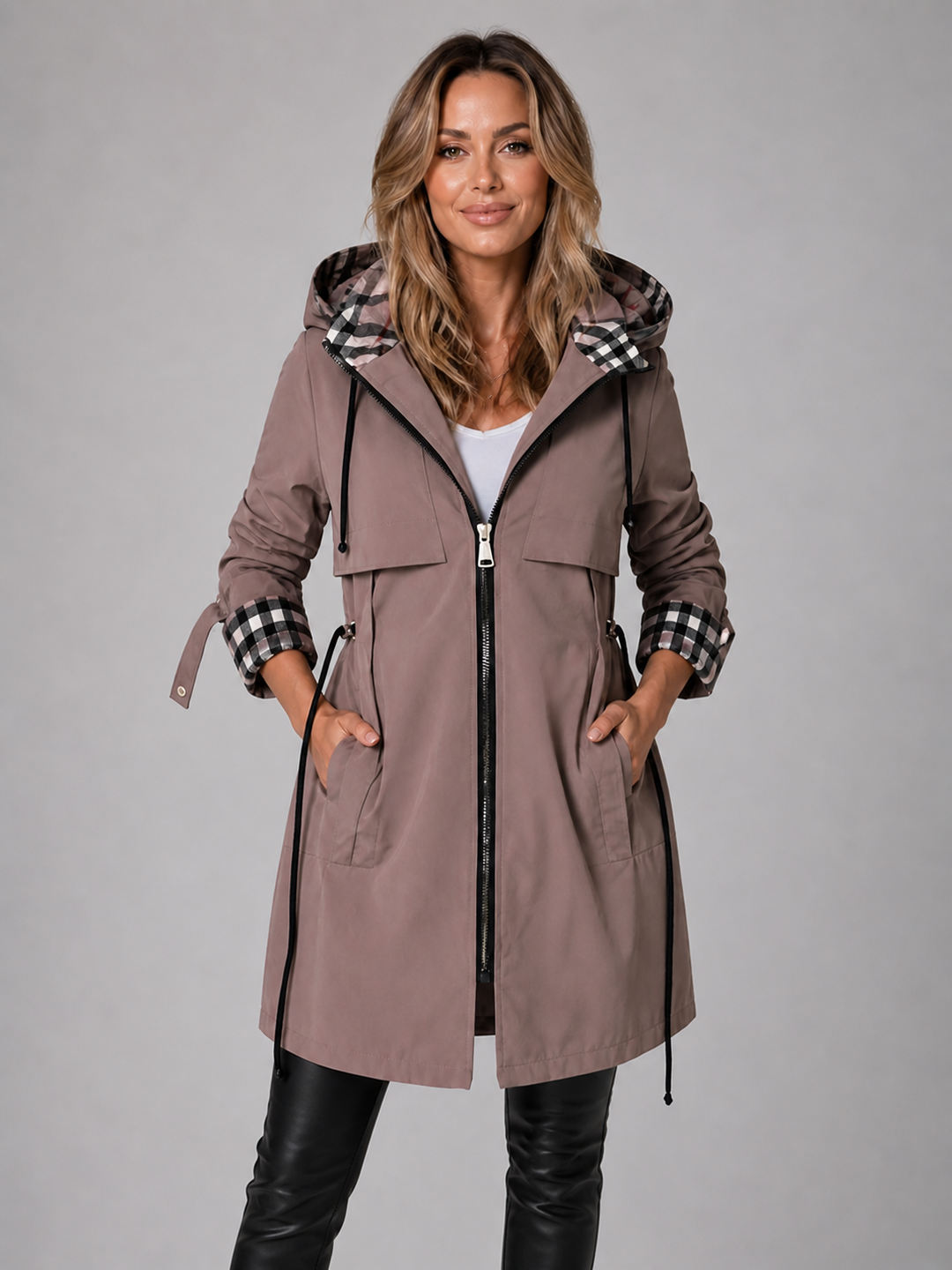 Taupe longline hooded coat with a drawstring waist, full zip closure, and stylish contrast check-lined hood and cuffs.