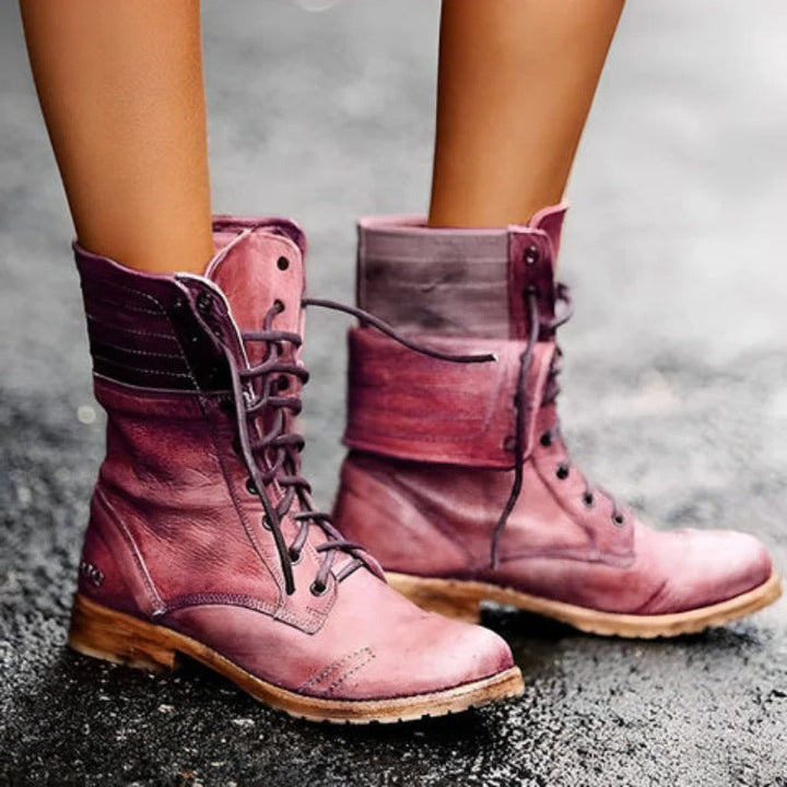 Delia vintage-style ankle boots in weathered plum leather with a rugged lace-up front and textured grip outsole.