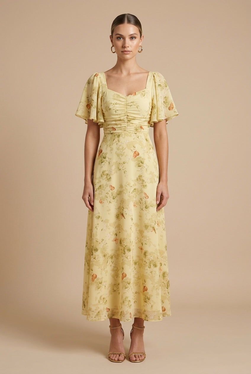Delilah women's yellow floral square neck maxi dress with ruched bodice and flutter sleeves.