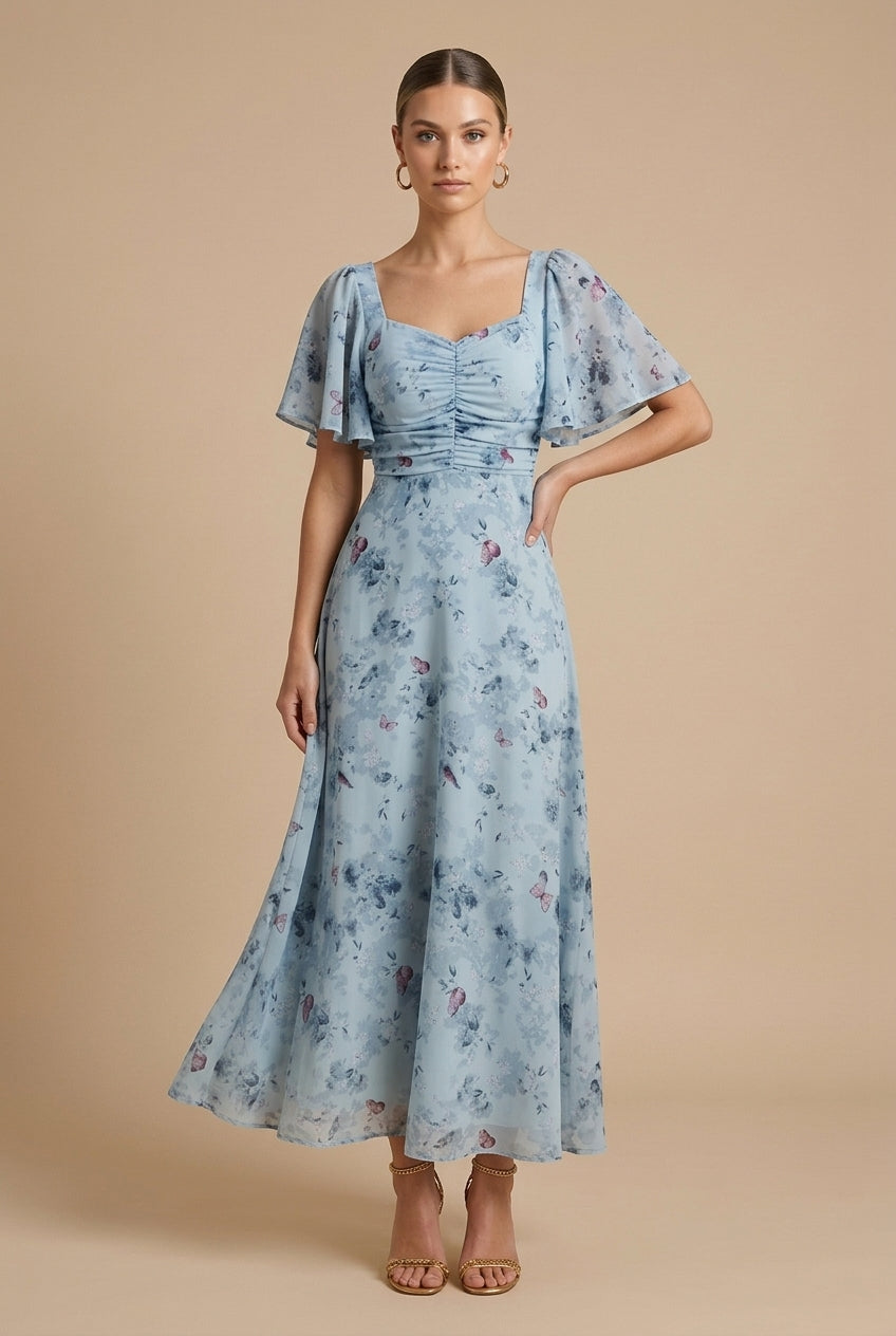 Delilah women's floral square neck maxi dress in soft blue with flutter sleeves and ruched bodice.