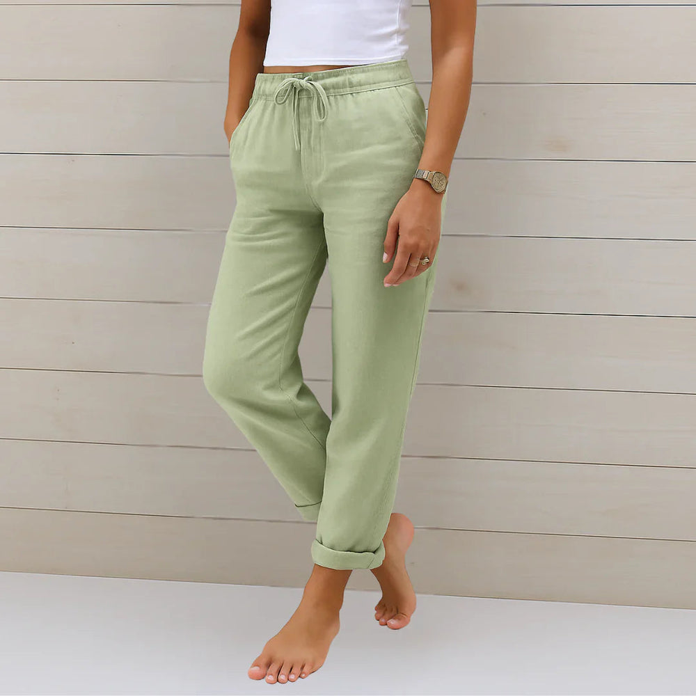 Delilah women's high-waisted, relaxed fit trousers in a soft sage green with an elastic drawstring waist.