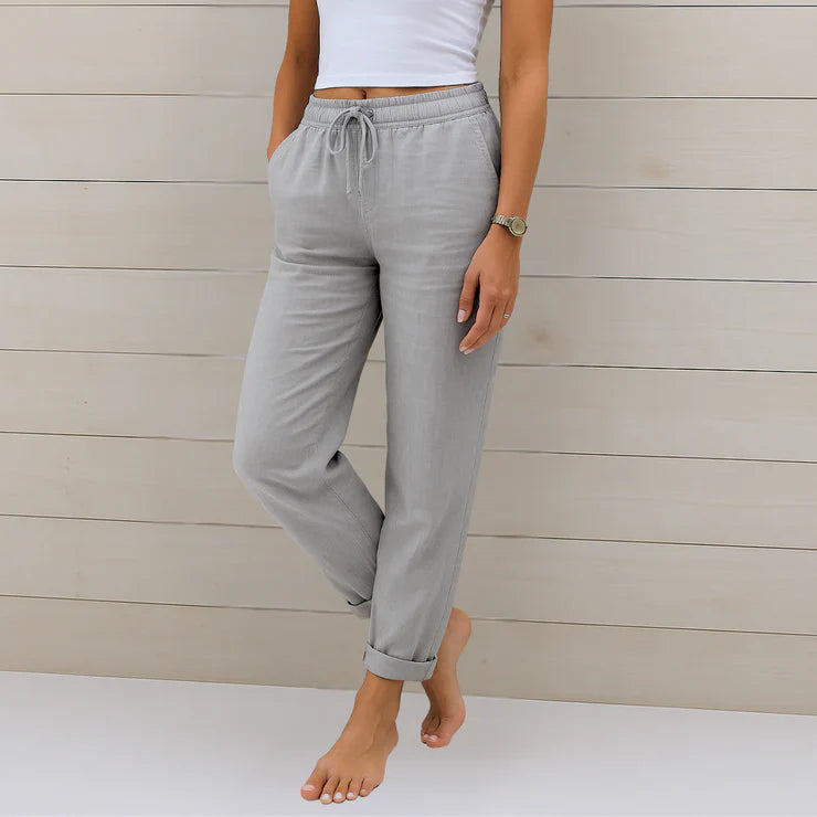 Delilah women's high-waisted relaxed grey trousers with an elastic drawstring waist and cuffed ankles.