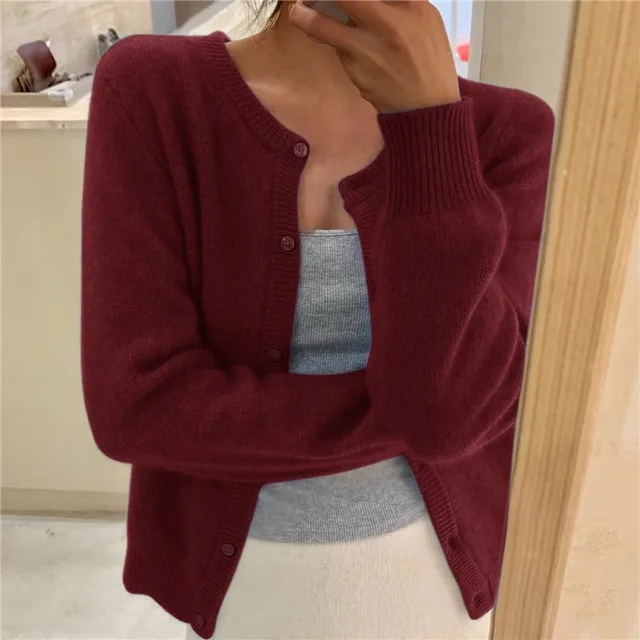Burgundy knit crew neck cardigan with long sleeves, ribbed cuffs, and a button-front closure.