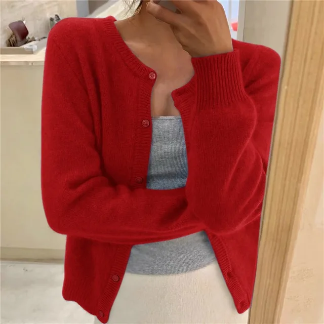 Bright red knit crew neck cardigan with long sleeves, ribbed cuffs, and a button-down front.