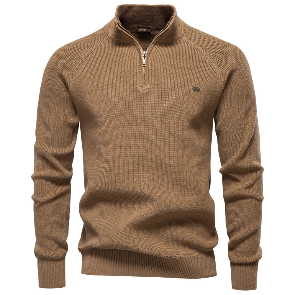 Tan quarter-zip knit sweater for men featuring a ribbed texture, stand-up collar, and a tailored fit.