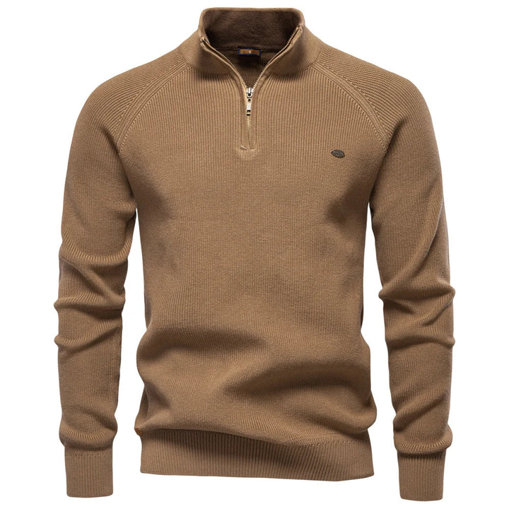 Tan quarter-zip knit sweater for men featuring a ribbed texture, stand-up collar, and a tailored fit.