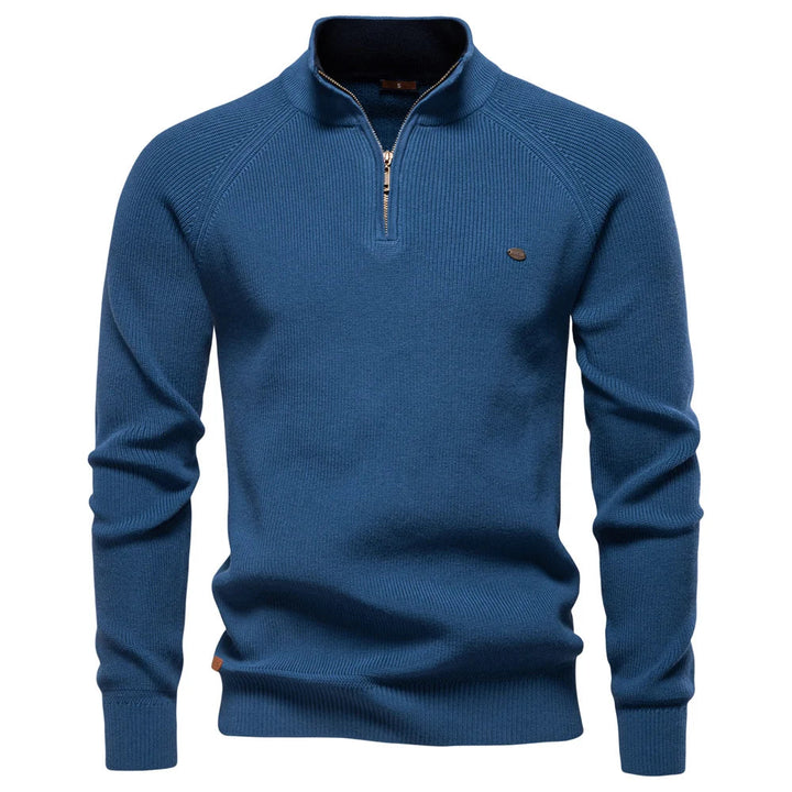 Blue men's quarter-zip knit sweater with ribbed texture, long sleeves, and a tailored fit.