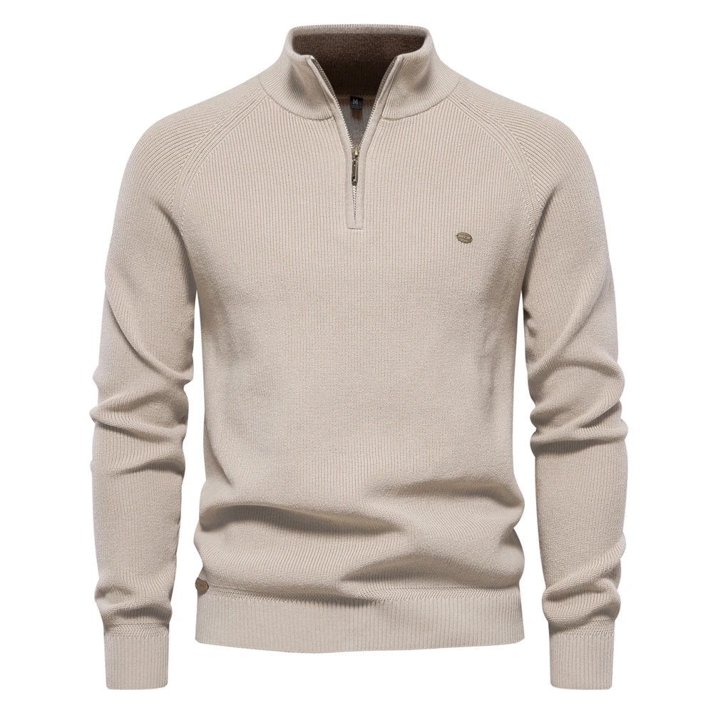 Beige men's quarter-zip knit sweater with ribbed cuffs, hem, and a tailored fit.