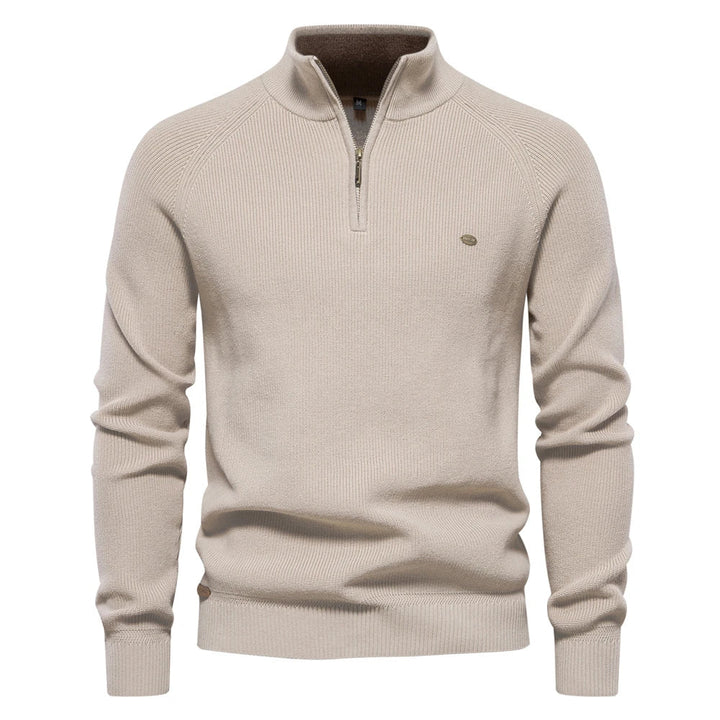 Beige men's quarter-zip knit sweater with ribbed cuffs, hem, and a tailored fit.