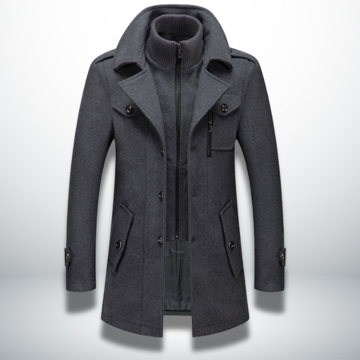 Charcoal grey men's wool-blend coat featuring a double collar, inner zip-up layer, button front, and utility pockets.