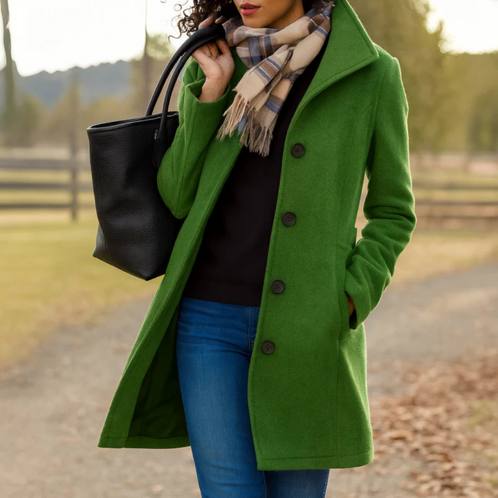 Women's green mid-length button-up winter coat with a structured collar, side pockets, and a tailored silhouette.