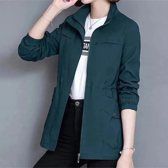 Dark teal lightweight women's jacket with a stand-up collar, full zip front, and an adjustable drawstring waist.