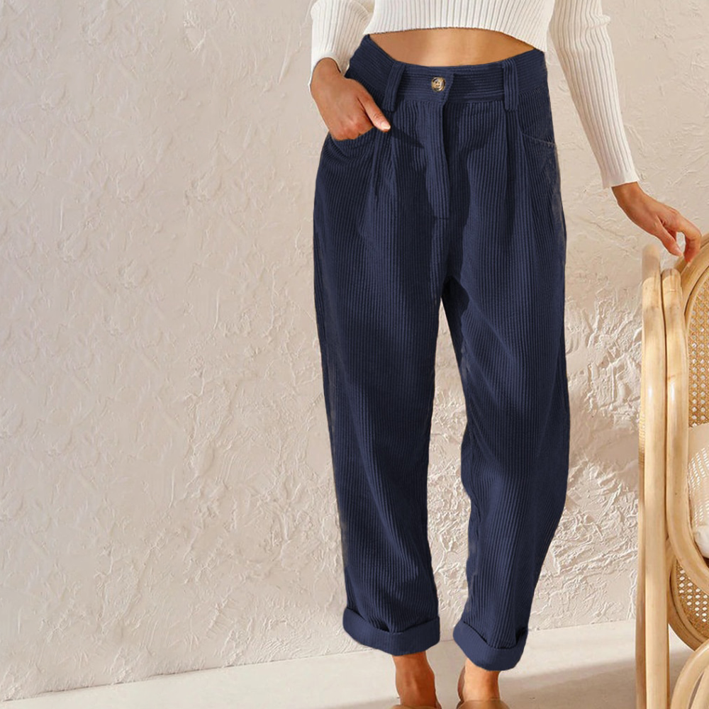Navy blue high-waisted corduroy trousers with a relaxed fit, button front, and cuffed hems.