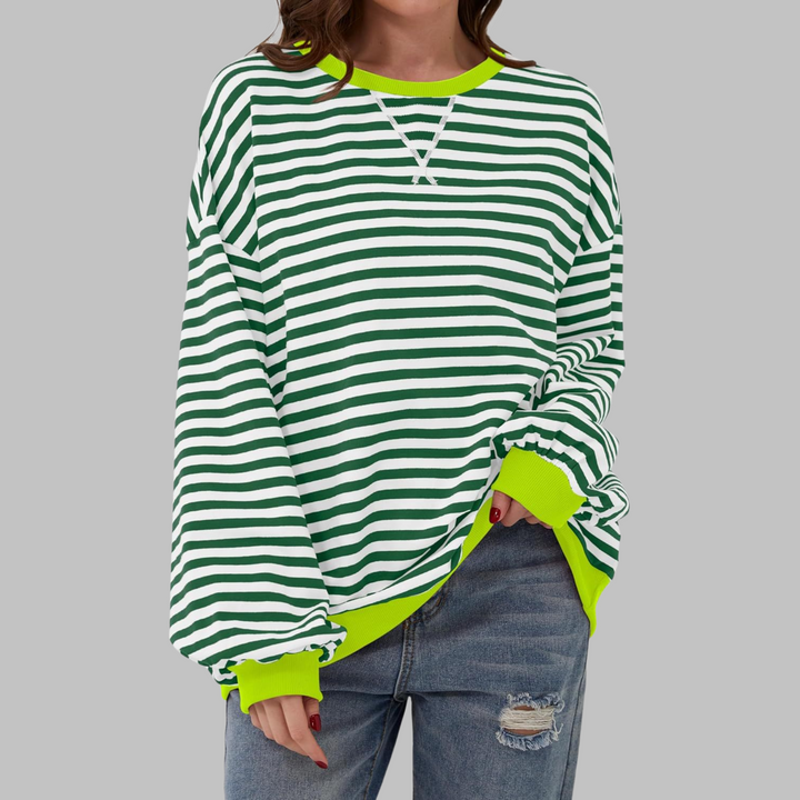 Oversized green and white striped sweatshirt with a vibrant lime green ribbed neckline and cuffs.