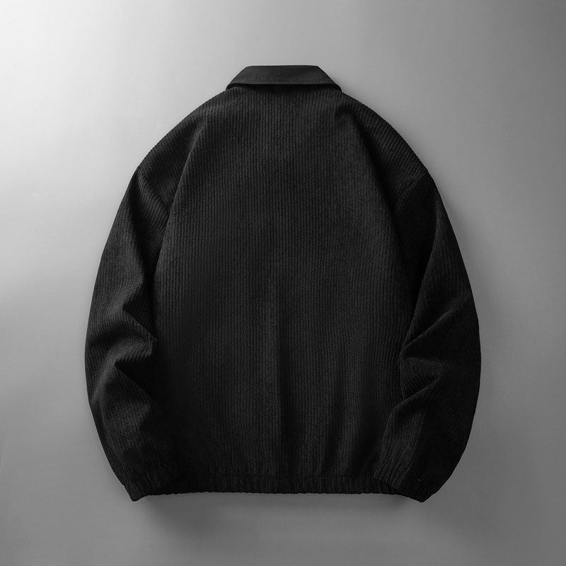 Back view of a black men's corduroy zip-up jacket with a collared neckline and elasticated hem.