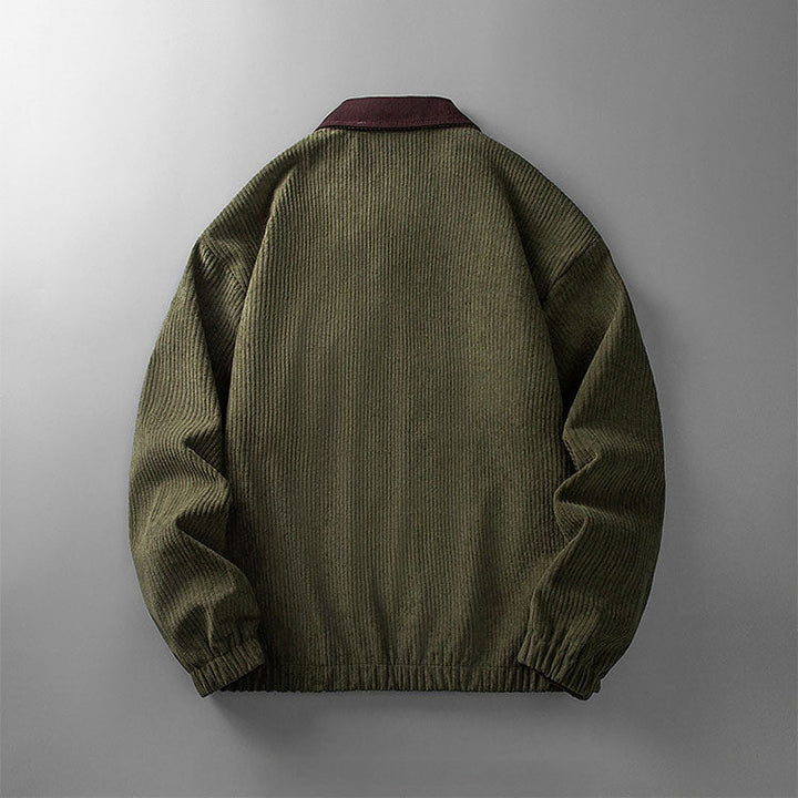 Back view of an olive green corduroy zip-up jacket with a contrasting dark maroon collar and elasticated hem.