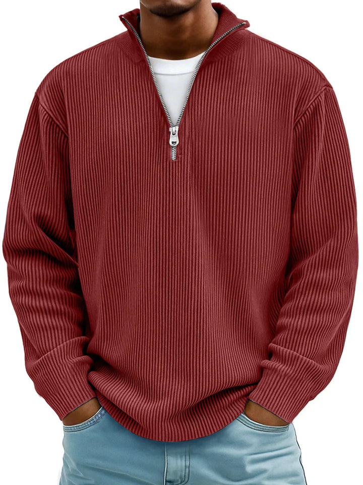 Men's burgundy ribbed half-zip sweater with a stand collar and relaxed fit, worn over a white shirt.