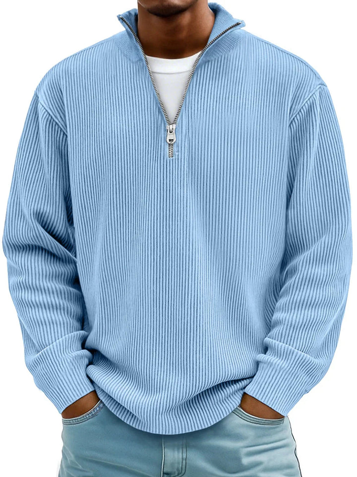 Light blue men's ribbed half-zip sweater with a stand collar and relaxed fit.