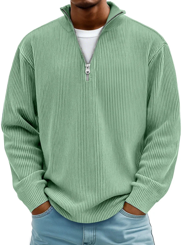 Sage green men's ribbed half-zip sweater with a stand collar and relaxed fit.