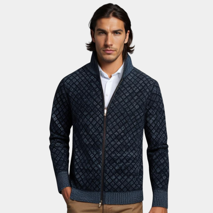 Navy blue diamond-textured knit zip-up cardigan with a stand collar and ribbed trim worn over a white shirt.
