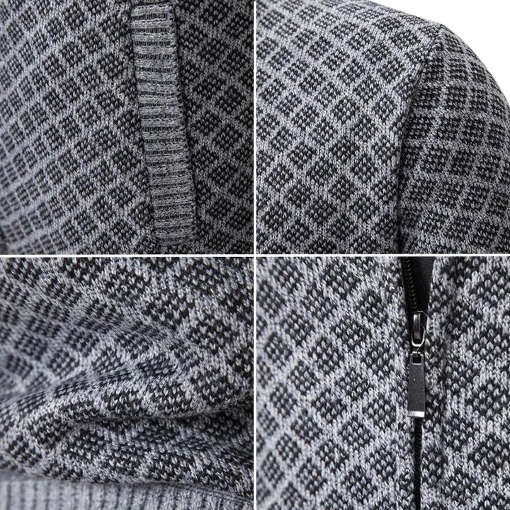 Close-up of a grey and black diamond-textured knit cardigan with a full-length metal zip and ribbed trim details.
