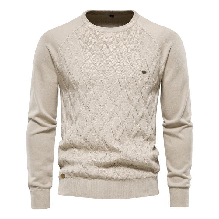 Beige men's crew neck jumper featuring a textured diamond-knit pattern, long sleeves, and ribbed cuffs and hem.
