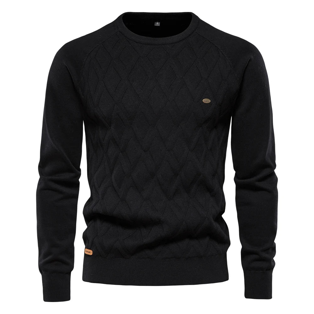 Black men's crew neck jumper featuring a textured diamond-knit pattern, ribbed cuffs, and a small branded hem tag.