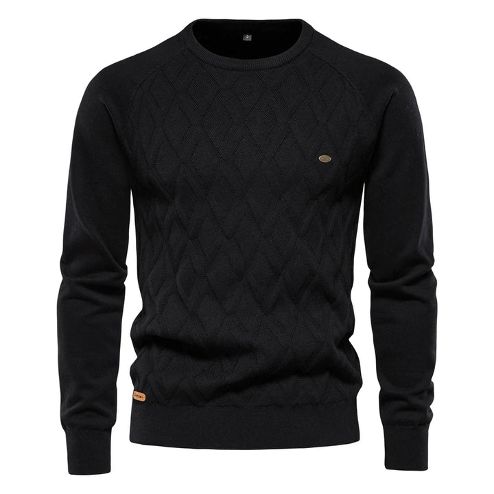Black men's crew neck jumper featuring a textured diamond-knit pattern, ribbed cuffs, and a small branded hem tag.