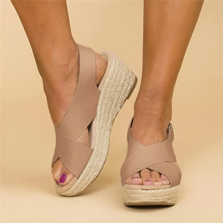 Women's Eloise orthopedic espadrille wedge sandals in nude leather with adjustable cross straps and jute-wrapped wedge.