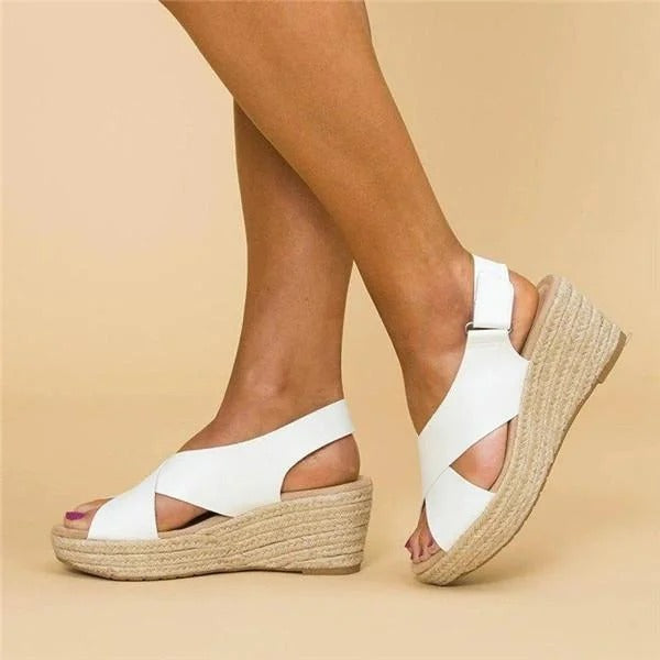 Women's white leather orthopedic espadrille wedge sandals with adjustable cross straps and jute-wrapped 2.5" wedge.