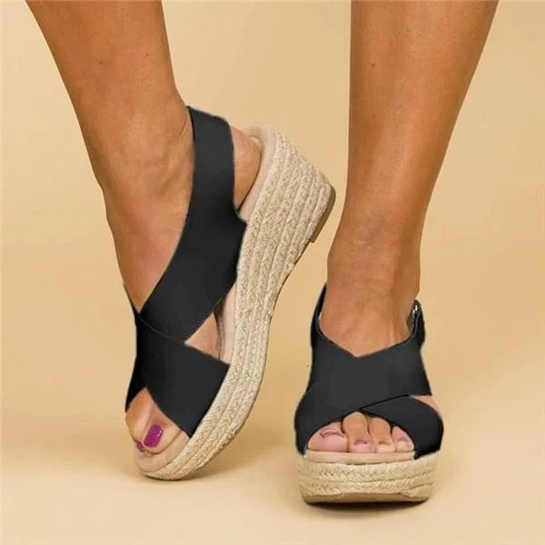 Eloise black leather orthopedic espadrille wedge sandals with adjustable cross straps and jute-wrapped heel.