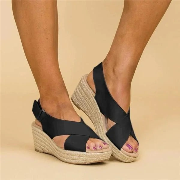 Women's Eloise black leather orthopedic espadrille wedge sandals with adjustable cross straps.