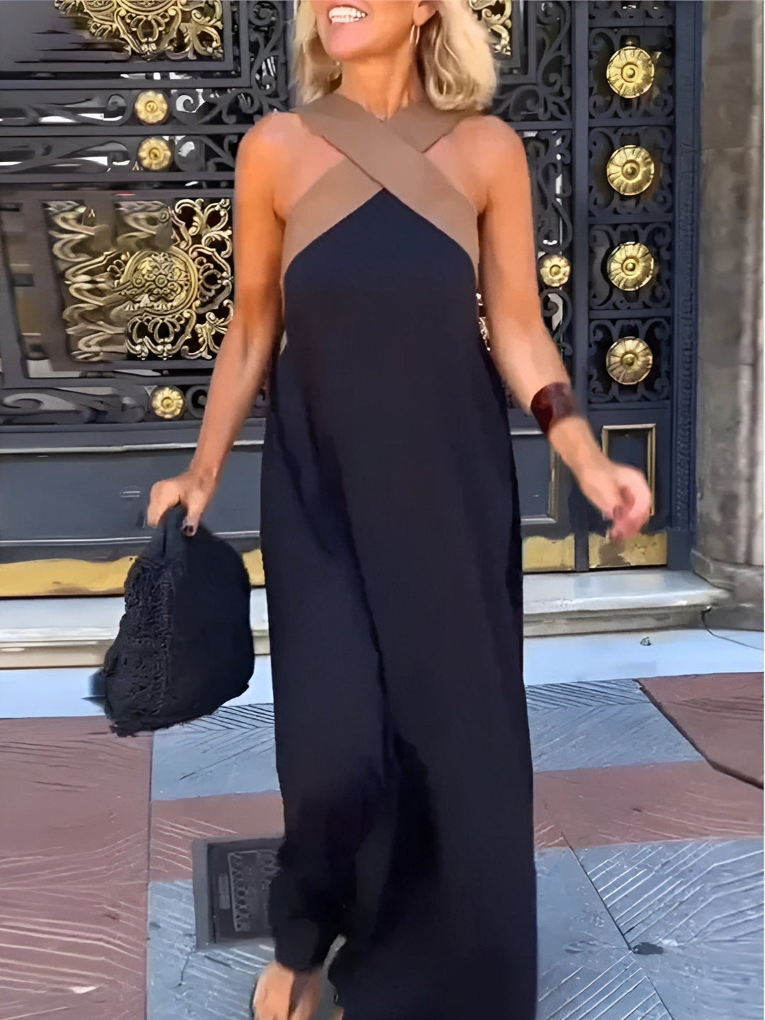 Elsie Women's Crossover Maxi Dress in black with a flattering tan crossover neckline, flowing gracefully.