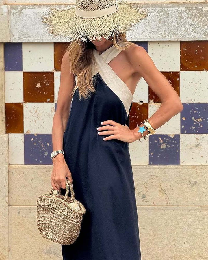 Elsie Women's Crossover Maxi Dress in navy and cream, with a straw hat and bag, perfect for breezy elegance.