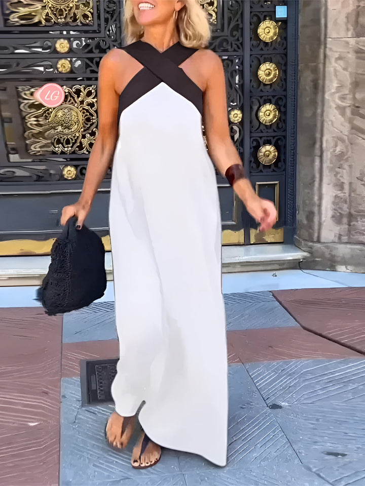 Elsie Women's Crossover Maxi Dress in white with black halter straps, flowing gracefully for breezy elegance.