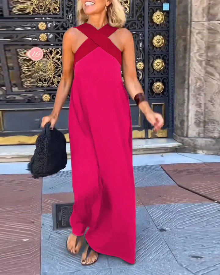 Elsie women's flowing maxi dress in vibrant pink with a flattering crossover neckline, perfect for breezy elegance.