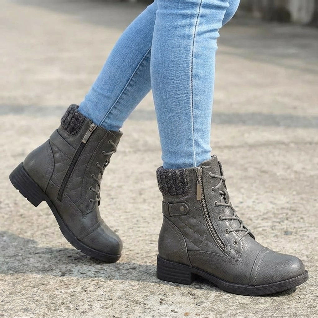 Grey faux leather ankle boots with quilted panels, knitted collars, lace-up fronts, and convenient side zips.