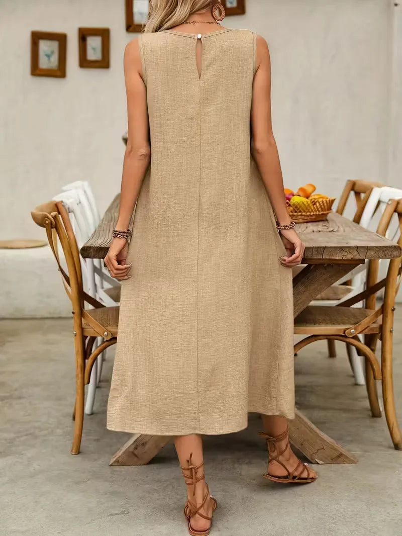 Women's Etta sleeveless A-line midi dress in textured beige, featuring a round neckline and keyhole back.