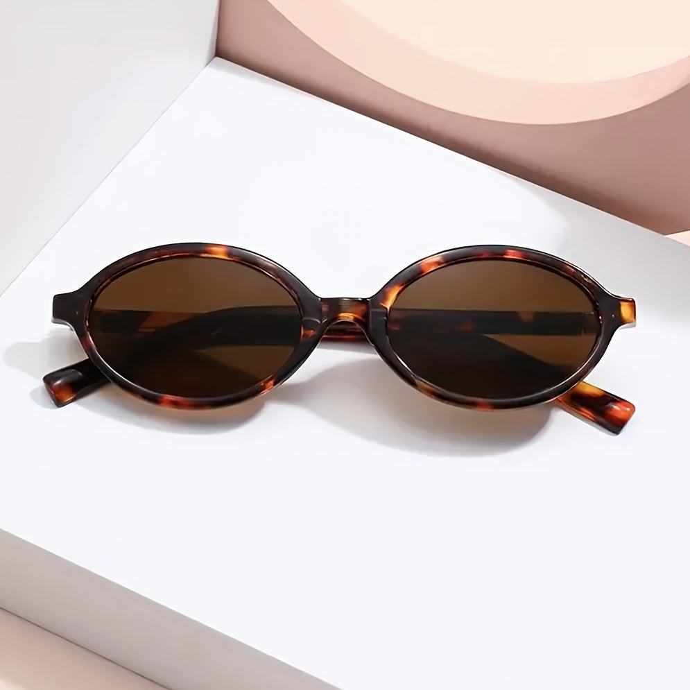 Evelyn retro oval sunglasses with tortoiseshell frames and tinted brown lenses, offering UV protection.