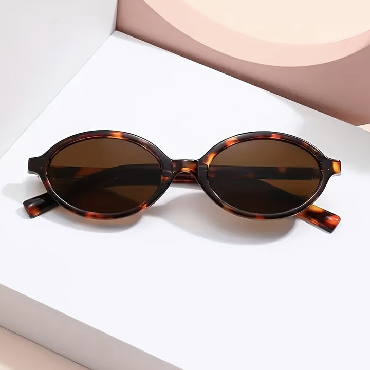 Evelyn retro oval sunglasses with tortoiseshell frames and tinted brown lenses, offering UV protection.