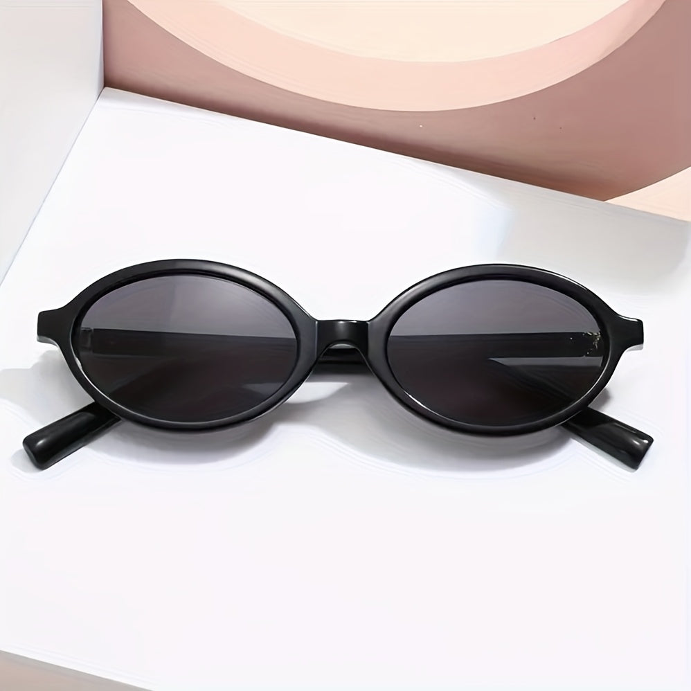 Evelyn black retro oval sunglasses with slim frames and tinted lenses for polished, vintage-inspired style.