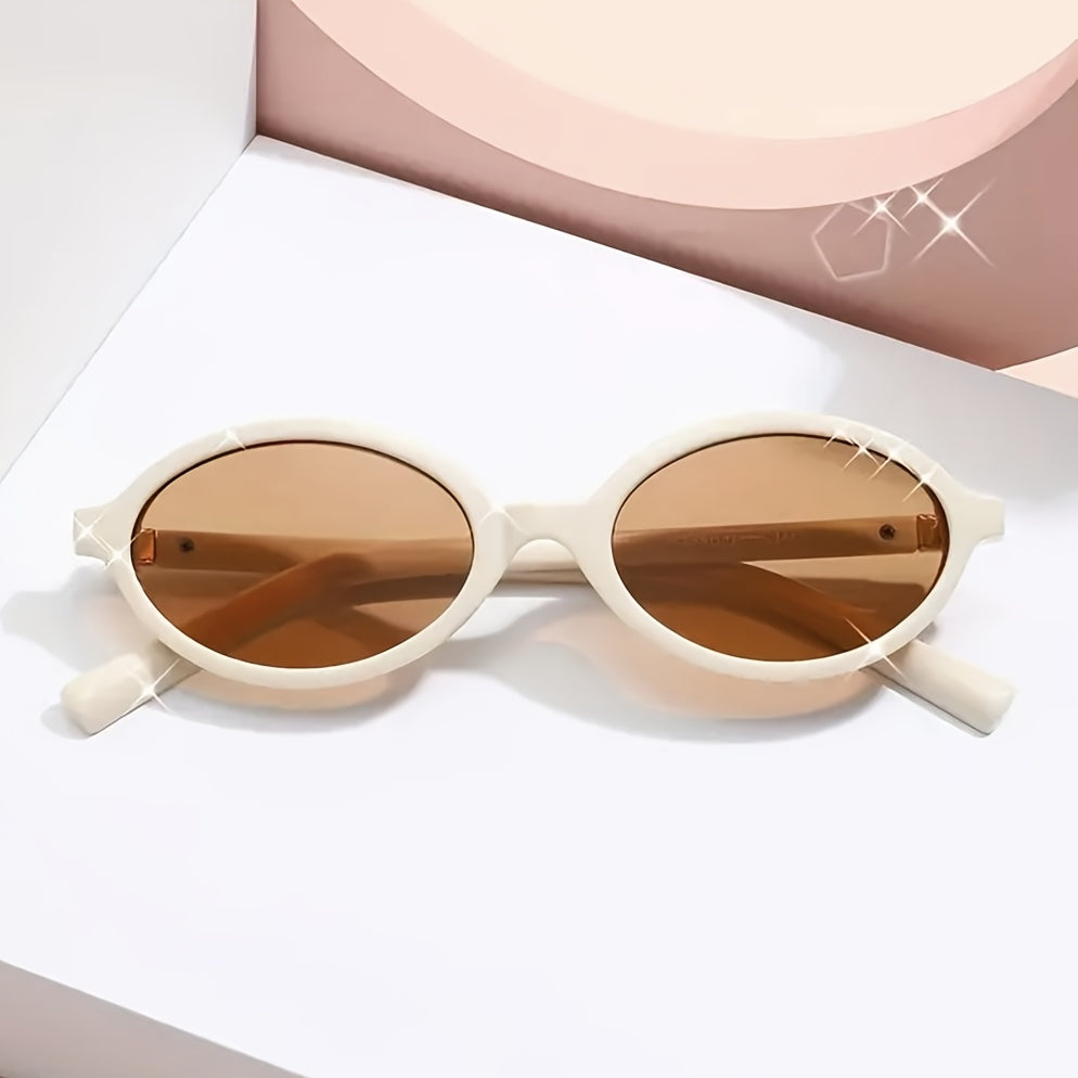 Evelyn women's retro oval sunglasses with slim cream frames and brown tinted lenses.