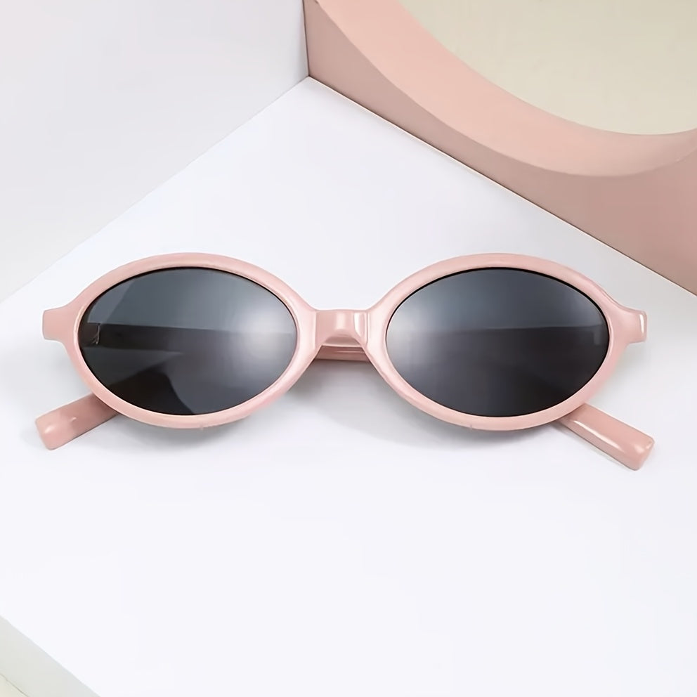 Evelyn women's retro oval sunglasses with slim pink frames and dark tinted lenses for UV protection.