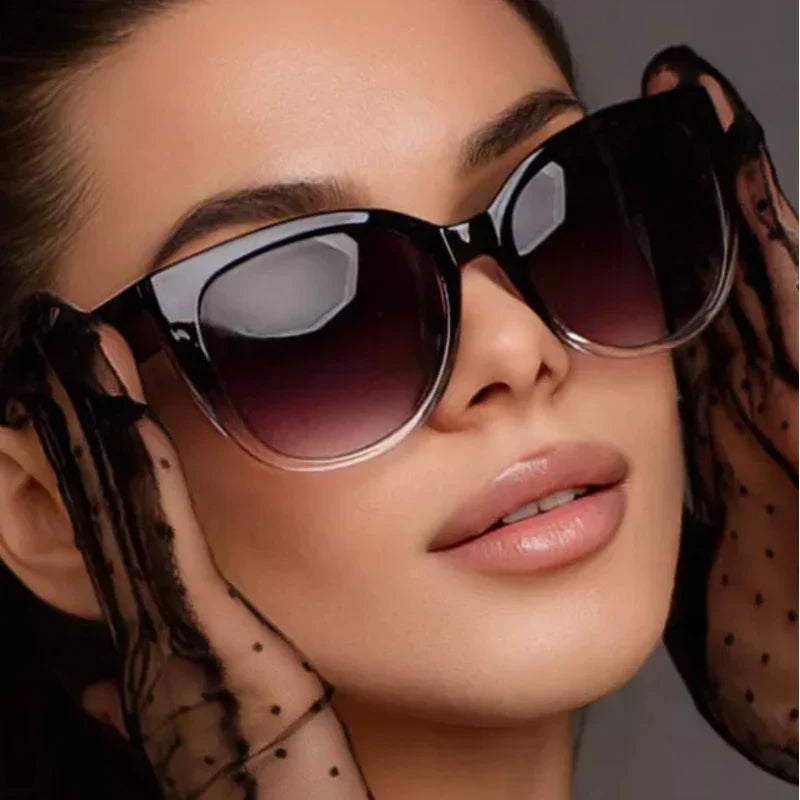 Faye Women's Butterfly Gradient Sunglasses with black-to-clear frames and refined gradient lenses.