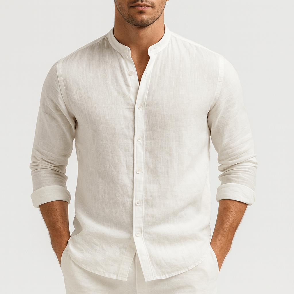 Man wearing a white, long-sleeve linen shirt with a modern grandad collar and relaxed fit.