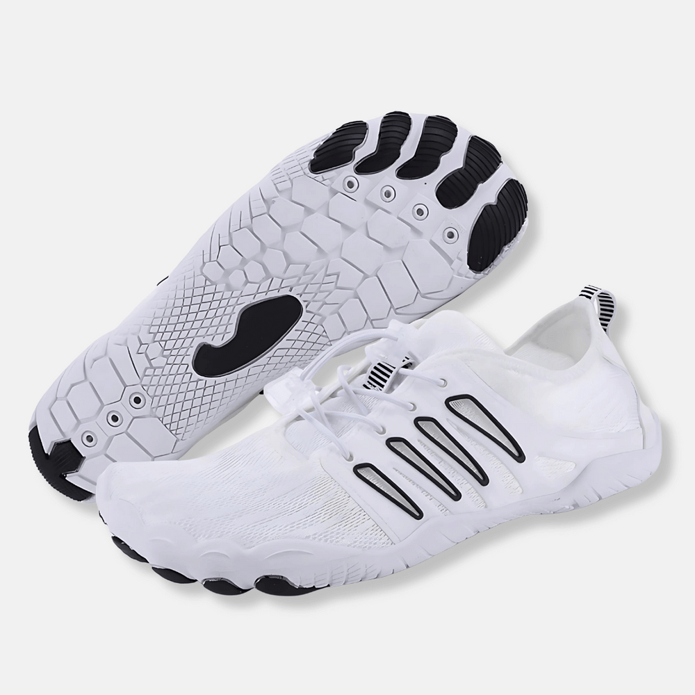 White lightweight barefoot walking shoes with ventilated mesh, bungee laces, and a flexible black and white treaded sole.