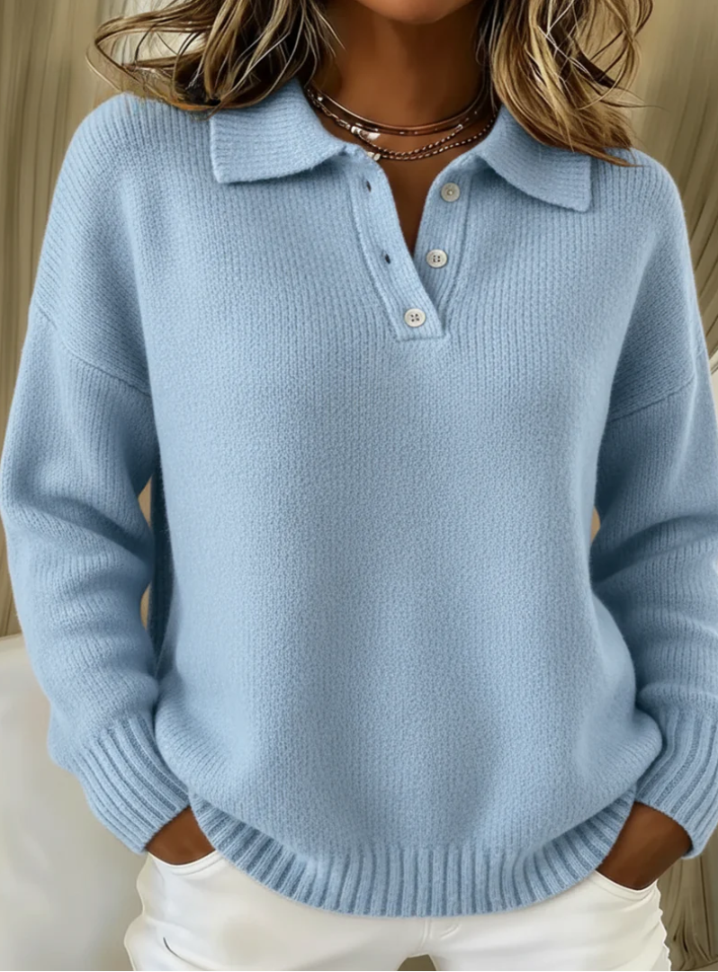 Light blue relaxed-fit knit jumper with a collared polo neckline, button placket, and ribbed cuffs.