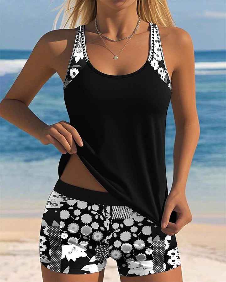 Freya women's black tankini with a scoop-neck top and coordinating floral print shorts for easy swim coverage.