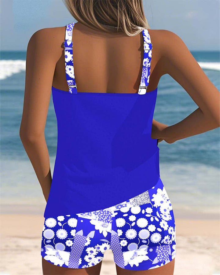Freya women's royal blue tankini top with white floral print shorts for easy swim coverage.